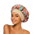 Detail of floral satin sleep bonnet with wide elastic band for hair protection - One Size / Dusty Pink