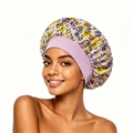 Close-up of floral satin bonnet with wide elastic band for curly hair protection - Light Purple