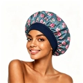 Close-up of floral satin sleep bonnet with grey-blue fabric and wide elastic headband - Turquoise Green