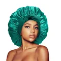Emerald green satin bonnet for hair care featuring a large decorative bow and silk finish - Emerald Green Cross Sleep Bonnet
