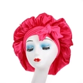 Detail of rose red satin bonnet with large ruffles and a decorative bow on head form - Rose Red