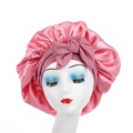 Detailed view of pink satin hair bonnet with wide elastic band and large bow decoration - Dust Rose