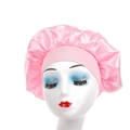 Pink satin sleep bonnet for hair protection featuring a wide elastic band on a mannequin - Pink