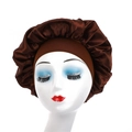 Detailed close-up of dark brown satin sleep cap with wide elastic band on a model head - Coffee