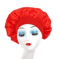 Detail of red satin sleep bonnet with wide elastic band on model head for hair care - Red