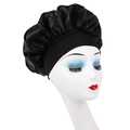 Kids black satin sleep bonnet with wide elastic band for hair protection on model - Black
