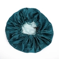 Detail of adjustable drawstring and toggle on a double-layer satin bonnet in green - One Size / Malachite green