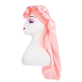 Detailed view of pink long-tail satin bonnet with decorative flower on white mannequin - Rose Pink