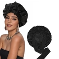 Detail view of black satin bonnet with adjustable elastic strap and bow for hair care - Black + Black Double Layer