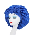 Elastic wide-band satin sleep bonnet with bow in royal blue on model head - Bow Knot Style / Sapphire Blue