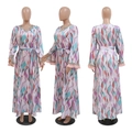 Detail of sequin embroidery and pink tassels on bohemian floral long sleeve dress - S / Pink