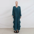Detail of beaded pearls and ruffled layered hem on dark green chiffon abaya dress - Green