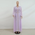 Detail of lavender mesh dress featuring intricate rhinestone floral patterns and pleats - Light Purple