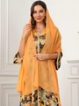 Detailed close-up of a vibrant orange chiffon hijab with abstract geometric print dress - Orange