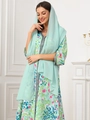 Detail of printed maxi dress with black woven trim and matching light green chiffon hijab - Light Green