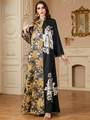 Close-up of intricate gold and silver sequin embroidery on black jacquard V-neck kaftan dress - Black