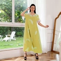 Detail of lime green dress featuring white feather embroidery and fluffy cuff trim - S / Yellow