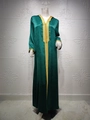 Detailed view of the emerald velvet kaftan with intricate gold embroidery and trim - Green