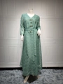 Detail of green mesh Abaya dress featuring intricate beaded crystals and geometric embroidery - S / Light Green