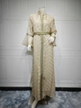 Detail of champagne kaftan with golden leaf embroidery and ethnic ribbon trim on sleeves - S / Apricot