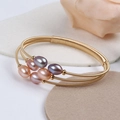 Macro detail of adjustable gold-wrapped wire bracelet with multi-color freshwater pearls - Six Colorful Oval Pearls Multi-layer Elastic Style (NO.4)