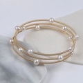 Triple-layer gold spring coil bracelet with natural white pearls in minimalist style - Three-layer Metal Spring Coil with White Pearls (NO.6)