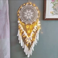 Large bohemian dream catcher with white feathers and warm LED lights on a gray wall - Sunflower Dreamy White with Lights