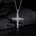Macro shot of silver cross pendant with sparkling zircons on a dark textured stone - Silver Exquisite Vintage Cross (款式68)