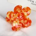 Floral acetate hair claw clip with orange and yellow marble pattern for women - Tropical Yellow