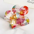 Floral acetate hair claw clip with colorful marble pattern and gradient resin texture - Tropical Red