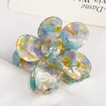 Floral acetate hair claw clip with colorful marbled pattern for elegant hairstyles - Cyan Gold