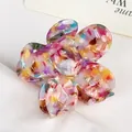 Floral patterned acetate flower hair claw clip with colorful marble texture and glossy finish - Colorful