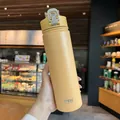 Mustard yellow insulated sports bottle with handle and matte stainless steel finish - Yellow