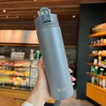Grey-blue vacuum insulated water bottle with matte finish and secure locking lid - Premium Grey