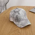 Close-up of sparkling rhinestones and floral sequins on a tie-dye denim baseball cap - Child Style (Adjustable) / Gray