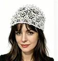 Elegant white lace crochet headband with pearl embellishments on a female model - White