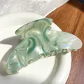 Elegant green marble acetate hair claw clip with pearlescent finish on ceramic plate - Dark Green 11CM