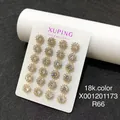 Set of 18k gold plated floral stud earrings with sparkling crystals on display card - Cross Pave Hoop / Gold