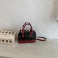 Elegant patent leather shell bag with red handles and black body for women - Red