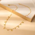 Detail view of a gold butterfly necklace with zircon pendants on a luxury display box - Butterfly Style (X636) / Gold