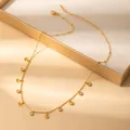 Detailed shot of golden anchor pendants and zircon charms on a stainless steel chain - Anchor Style (X641) / Gold