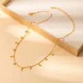 Detail of gold moon pendant necklace with cubic zirconia displayed in a jewelry box - Moon Style (X645) / Gold