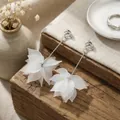Elegant white frosted petal drop earrings with silver bars in SKU view - Matte Translucent Petal Long Bar Clip-on Style (E1956-1/Silver)
