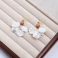 Elegant white petal drop earrings with brown pearl accents in jewelry box display - Champagne Artificial Pearl White Shell Style (E7518/Clip-on)
