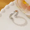 Detail shot of a silver honeycomb geometric ring on a ceramic plate with flowers - Adjustable Open / Silver Hexagon Honeycomb Shape Style (P)