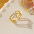 Detail of gold crossover ring with micro-pave diamonds and heart-shaped zircon detail - Adjustable Open / Gold Multi-ring Heart and Round Diamond Style (U)