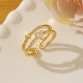 Detail of double-layer gold ring with heart zircon and pavé crystals on a ceramic tray - Adjustable Open / Gold Multi-layer Heart Shape Micro-pavé Style (W)