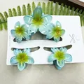 Three-piece plumeria flower hair claw set with ice blue and yellow gradient finish - Large Claw Clip And Small Hair Clips / Triple Plumeria Gradient Blue