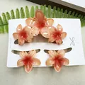 Set of 5 orange gradient frangipani hair claws with marble finish on display card - Three Frangipani Flowers - Gradient Red Set (includes Card)