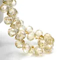 Macro view showing faceted champagne yellow K9 crystal teardrop beads with brilliant sparkle - Electroplated Silver Champagne / 6mm (approximately 87 Beads Per Strip)